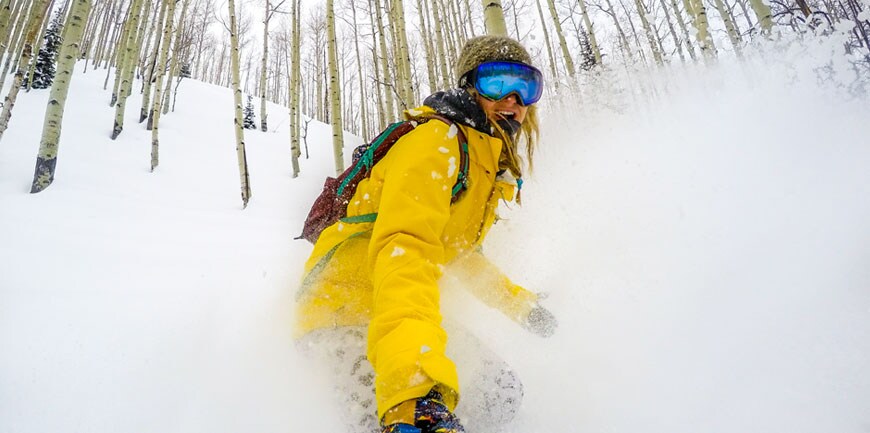 Hannah Teter snowboarding through trees Hannah Teter snowboarding through trees
